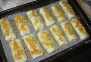 Roll out the cut pieces of dough into small circles. Periodically sprinkle the work surface and rolling pin with flour so that the dough ...