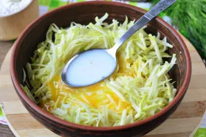 Beat the eggs and pour in the milk, stir.