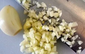 Chop the garlic with a knife or throw it through a press.