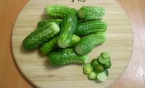 For cucumbers, cut off the stems. Boil water.