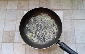 Fry until the onion becomes transparent.