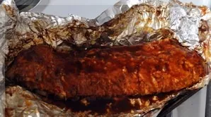 Bake the ribs in the oven for 2 hours at a temperature of 180 degrees. Then open the foil, coat with barbecue sauce and bake for another ...