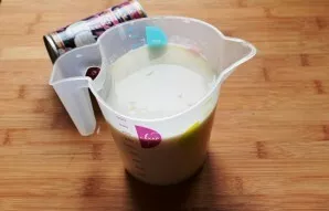 Grate the lime and set aside. Mix coconut cream with sugar until completely dissolved. Pour in the liqueur. Squeeze lime juice into the c...