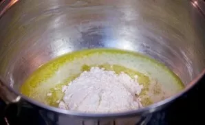 In a separate container over medium heat, melt the remaining butter. Add flour and stir with a spatula.