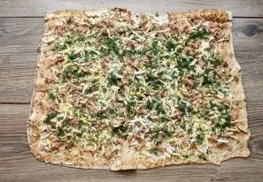 Finely chop the greens and sprinkle them in an even layer.