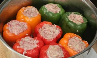 Add salt, pepper to the filling to taste, mix again and fill the peppers. Put the peppers in a large saucepan, pour broth and warm water....