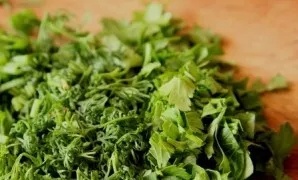 Finely chop the washed and drained greens.