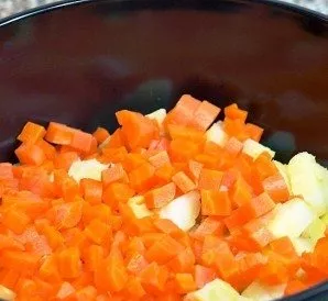 Place the carrots and potatoes in a bowl.