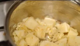 Peel and wash the potatoes. Cut into large pieces with a sharp knife. Put the prepared tubers in a saucepan with onion and oil and fry fo...