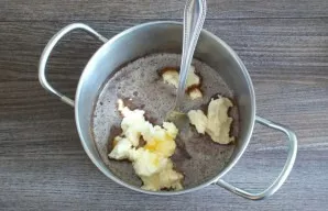 Add soft butter and put on low heat. Heat, stirring occasionally, until the butter melts. Do not bring to a boil.