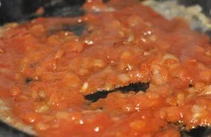 Now we add tomato paste and add spices to taste, I usually add a mixture of ground black pepper and dried herbs.