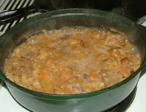 After an hour, add another glass of water (boiling water), cover with a lid and place the porridge in an oven preheated to 180 degrees, w...