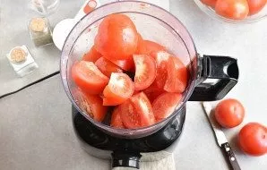 Cut the stems from the tomatoes. Coarsely chop the tomatoes and place in a food processor and puree.