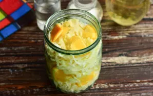 Add the cabbage and oranges to the jar.