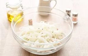 Add pickled onions to the meat.