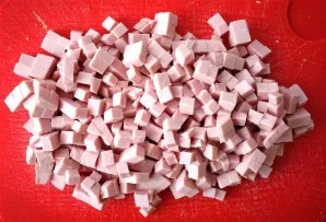 Cut the doctor sausage into small cubes.