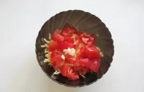 Add the crushed clove of garlic.