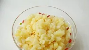 Cut the pineapple into cubes.