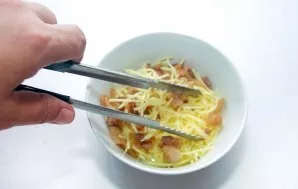 Grate the cheese on a coarse grater and mix with bacon.