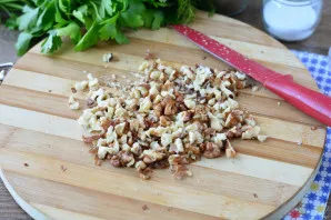 Grind the nuts a little with a knife.