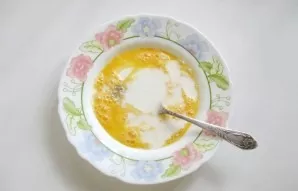 Pour in the milk and add a pinch of salt.