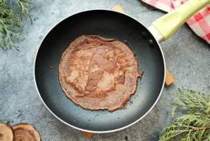 Heat the pan over low heat, grease with vegetable oil and pour part of the dough, spread it into a thin pancake. Fry on both sides until ...