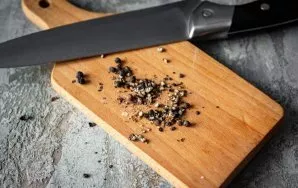 Grind black pepper peas in a coffee grinder or crush with a wide knife on a cutting board. Freshly ground or freshly crushed pepper is ve...