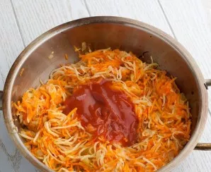 Pour in the tomato sauce, stir and simmer for a few more minutes.