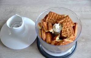 Put cookies in a blender, grind.