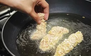 Place the chicken fingers in hot oil. It is better to choose a pan with high edges, as the oil will splash out. Fry on both sides until b...