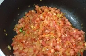 Add chopped tomatoes, simmer and bake for 10 minutes
