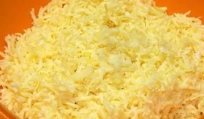 Mix cheese with eggs, add garlic squeezed through a press.