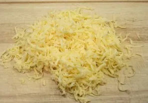 Grate the cheese through a coarse grater.