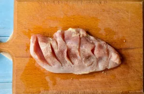 Salt the meat and sprinkle with pepper on all sides and inside.