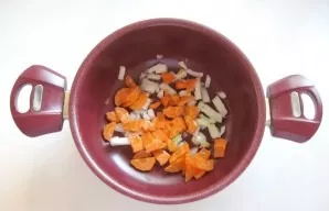 Peel, wash and chop one onion and carrot. Put in a non-stick saucepan or pan.