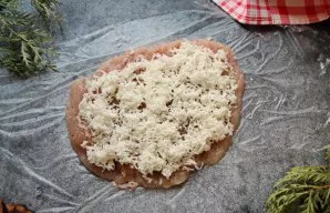 Grate the cheese and put half on the fillet.