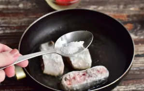 Heat vegetable oil in a pan. Add the fish. Season each piece with salt. Cook until both sides are nice and golden.
