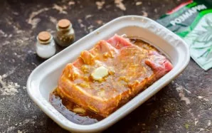Rinse and dry the ribs, pour the marinade, leave for 4-5 hours. Place the marinated ribs in a preheated oven and bake under the foil for ...