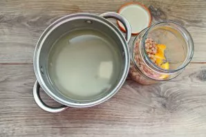 Pour liquid from the jar into a saucepan and add sugar.