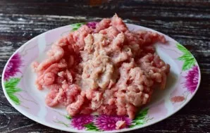 Grind meat and onions.