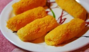 We take the base for potato sticks, wet our hands with water, form sticks with a piece of cheese inside. Roll in breadcrumbs and fry in o...