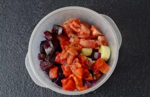 Put all the prepared vegetables in one bowl. Add peeled garlic, olive oil, all the spices and wine vinegar. Crush with a blender to a hom...