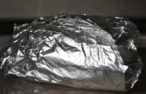 Wrap the bread in aluminum foil and bake in an oven at 175 degrees for about 20 minutes.