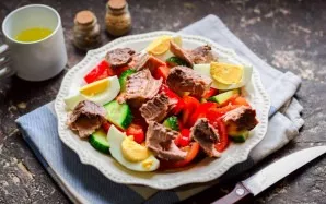 Add tuna to salads. Mix oil, lemon juice and soy sauce, sprinkle the salad. Add salt and pepper to taste.