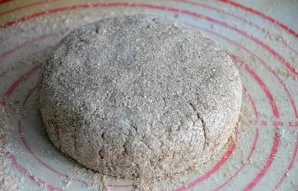 Sprinkle the working surface of the table with bran, lay out the dough and carefully, without kneading too much, form bread of any shape.