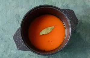 Pour the sauce back into the pot, add salt and sugar, bay leaves and black pepper. Cook for about an hour on medium heat, stirring consta...