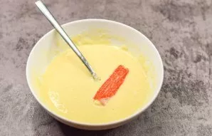 Dip each stick into the prepared dough.