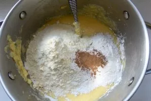 Add both types of flour, spices and baking powder. Stir until smooth.