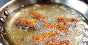 In a large frying pan over medium heat, heat the rapeseed oil. Put the cheese sticks in the pan, about 8 pieces in one batch. Cook until ...