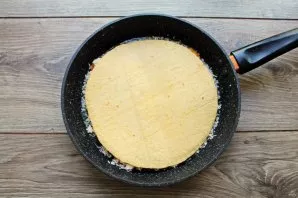 Put a second round sheet of lavash on top. Put the pan on low heat, cover the lid and fry for 5-7 minutes. Make sure that the lavash does...